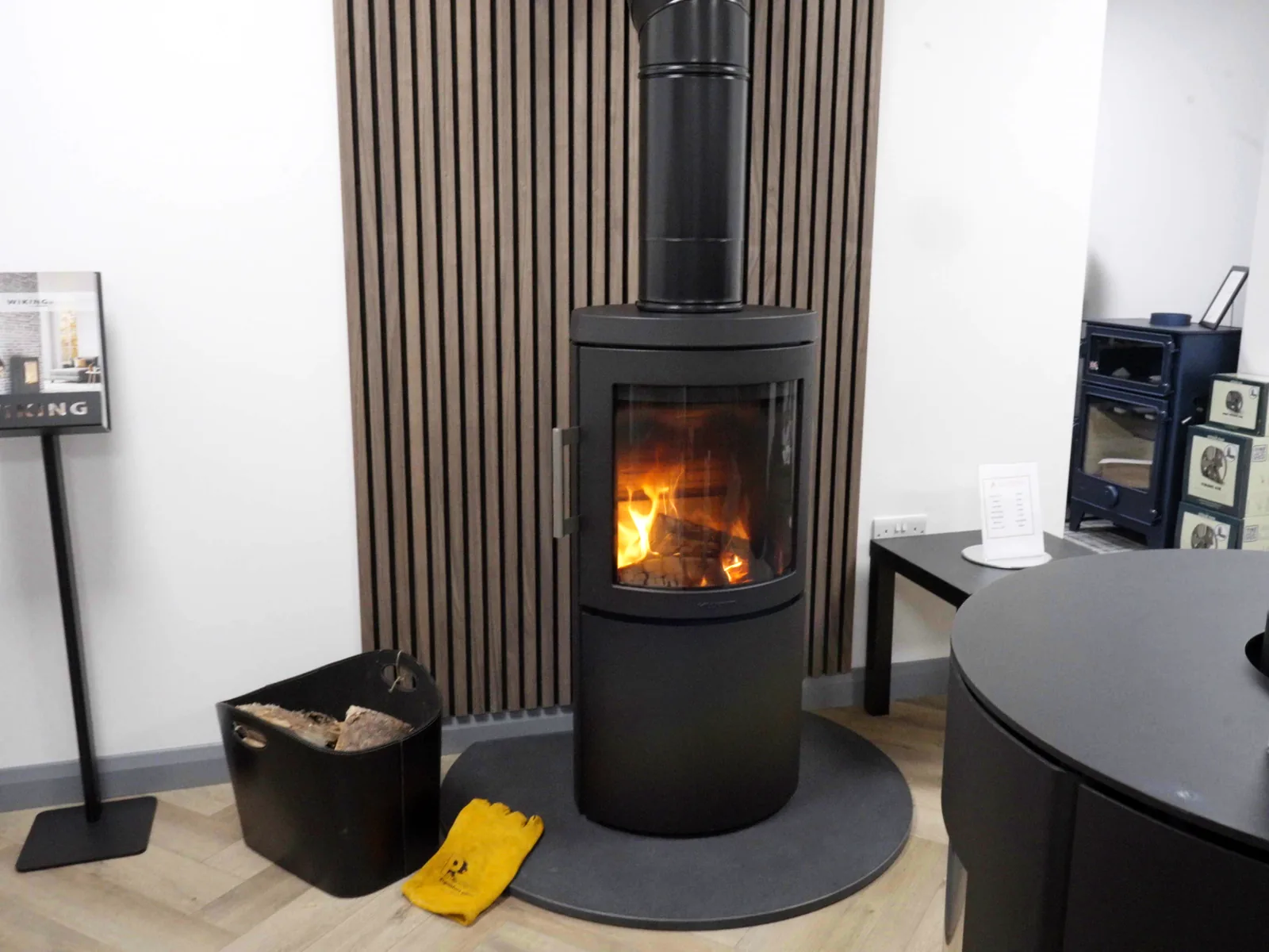 A lit freestanding stove on display in the Fife Stoves showroom, Kirkcaldy